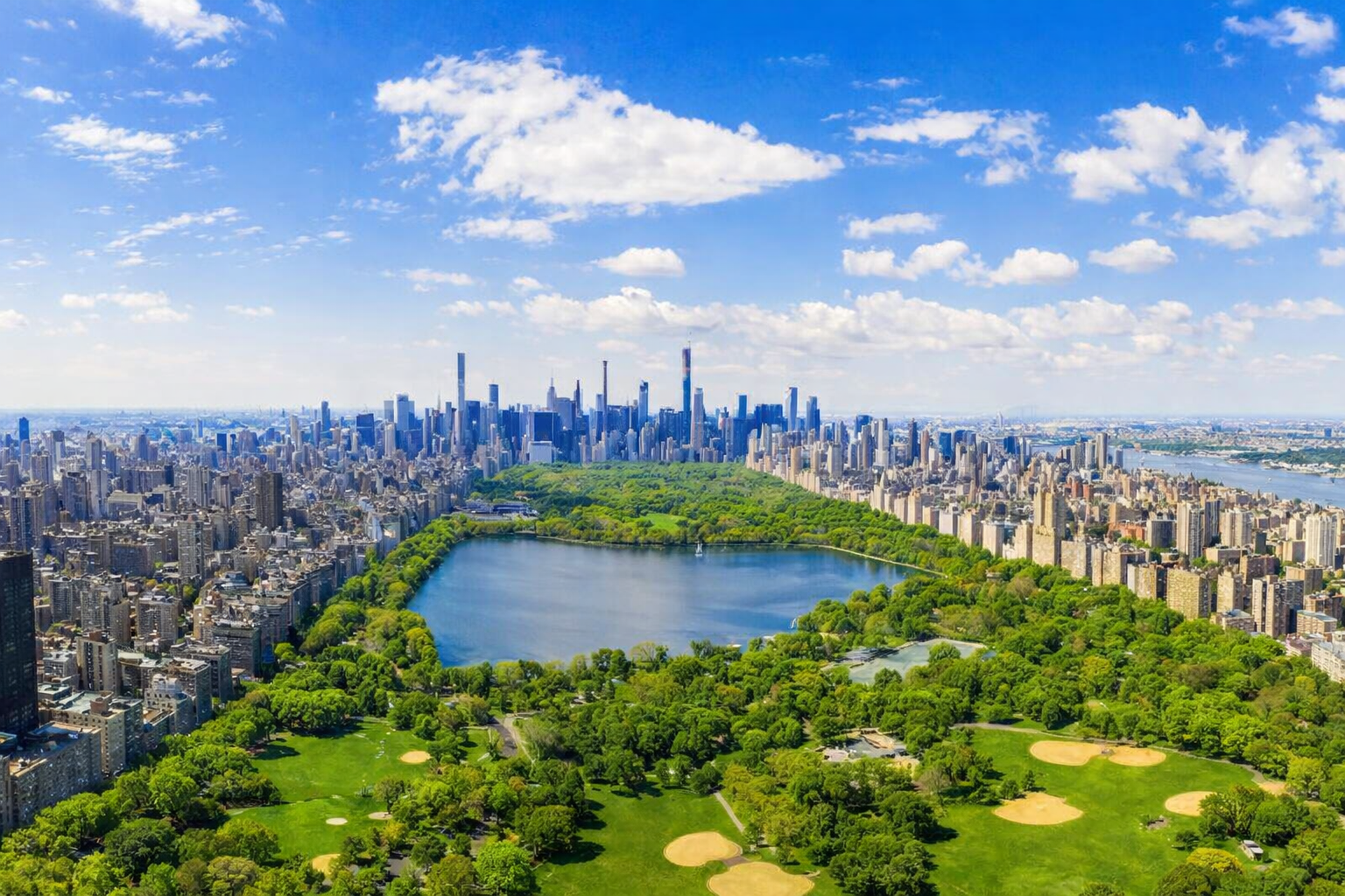 Aerial view of Central Park surrounded by Manhattan skyline, representing property management services across New York City.