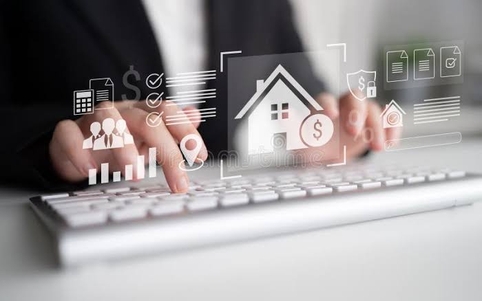 Hands typing on a keyboard with digital real estate and analytics icons, representing Property Financial Management.