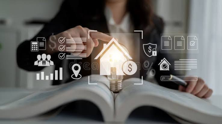 Professional pointing to a glowing digital house graphic and financial icons above an open book, illustrating Property Financial Management concepts.