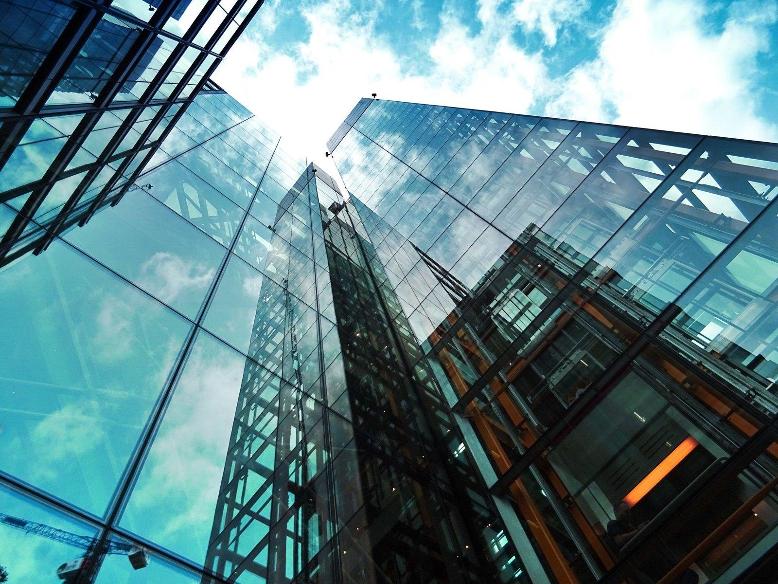 Glass high-rise representing fair, written tenant screening criteria